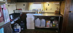 Kitchen featuring wallpapered walls