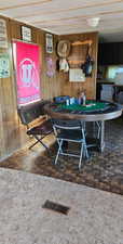 Rec room with wood walls