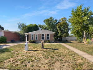 Ranch-style house featuring brick siding