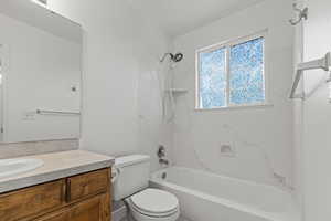 Full bath with washtub / shower combination and vanity