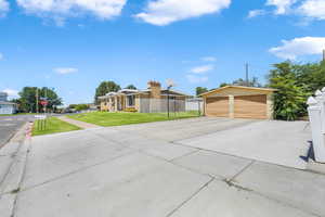 View of front facade with a garage and an outdoor structure