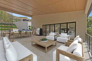 View of patio featuring outdoor lounge area, an outdoor kitchen, and outdoor dining space