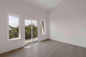 Unfurnished room featuring wood finished floors and baseboards