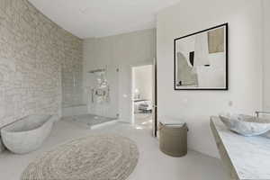Ensuite bathroom featuring a freestanding tub, walk in shower, vanity, and tile patterned flooring
