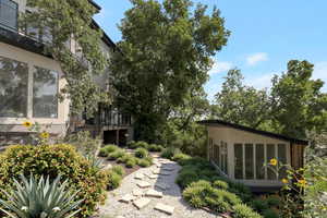 View of yard with a sunroom