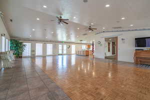 Building lobby with vaulted ceiling and recessed lighting