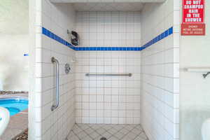 Full bathroom featuring a stall shower