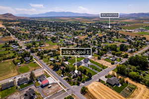 Aerial perspective of suburban area with a mountain backdrop