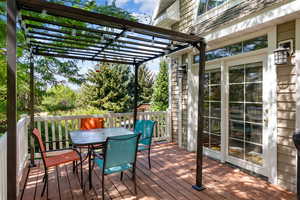 Wooden terrace featuring outdoor dining area