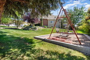 View of jungle gym with a yard