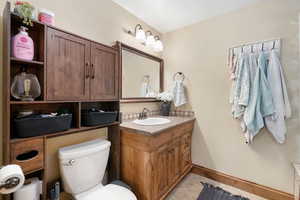 Bathroom featuring light tile patterned floors and vanity