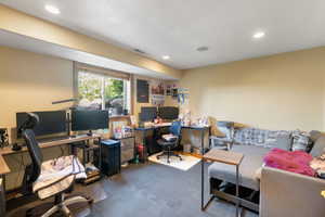 Office area with recessed lighting and a textured ceiling