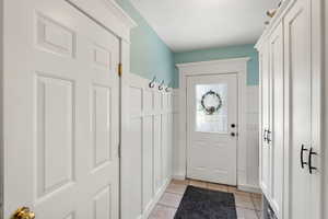 Entryway with tile patterned floors