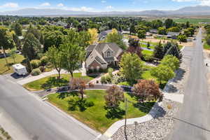 Aerial view of residential area featuring a mountainous background