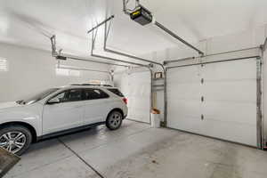Garage featuring a garage door opener