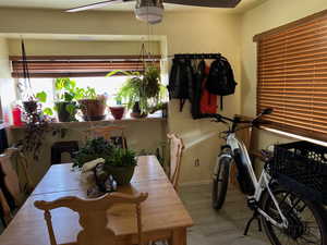 Dining space with wood finished floors and baseboards