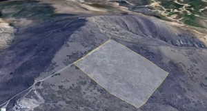 Aerial map of property and surrounding area featuring property parcel outlined