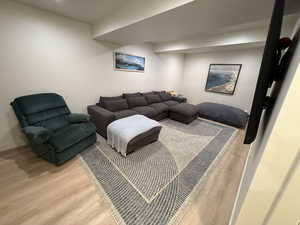 Living room with wood finished floors and baseboards