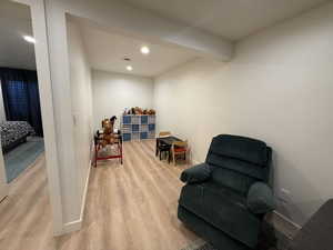 Sitting room featuring light wood finished floors and recessed lighting