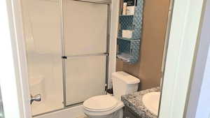 Full bath featuring vanity and a shower stall