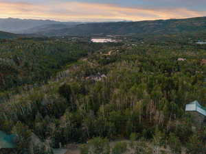 Aerial overview of property's location featuring a water and mountain view