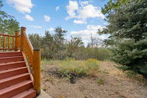 View of yard featuring stairway
