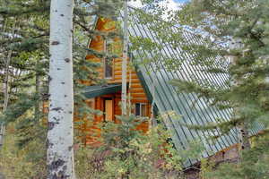 View of home's exterior with faux log siding