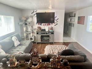 Living room with wood finished floors and baseboards