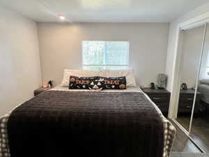 Bedroom featuring a closet and wood finished floors