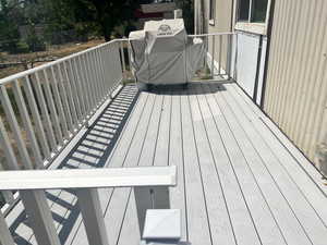 Wooden deck with a grill