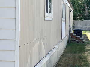 View of home's exterior featuring a cooling unit