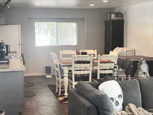 Dining area with recessed lighting and baseboards