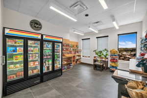 Game room with a paneled ceiling