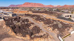 Aerial perspective of suburban area featuring a mountain backdrop