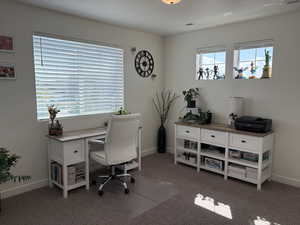 Office space with carpet floors and baseboards