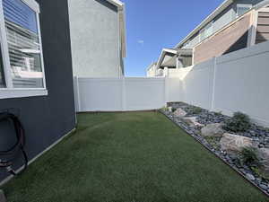 View of fenced backyard