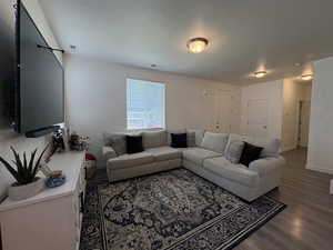 Living room featuring wood finished floors and baseboards