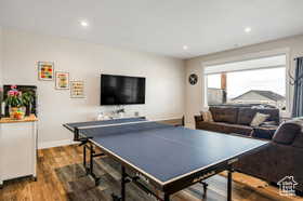 Playroom with recessed lighting and wood finished floors