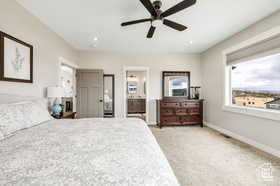 Bedroom with light carpet, a ceiling fan, connected bathroom, and recessed lighting