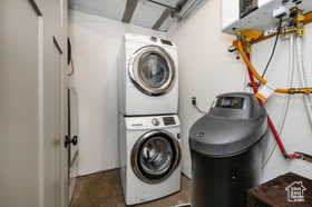 Laundry area featuring stacked washer and clothes dryer