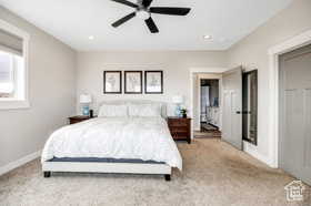 Bedroom with light colored carpet, recessed lighting, and ceiling fan