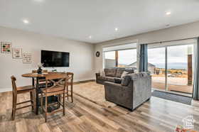 Living area featuring recessed lighting and light wood finished floors