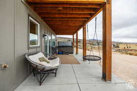 View of patio / terrace featuring a hot tub