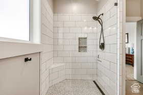 Bathroom featuring tiled shower