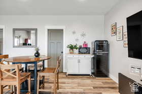 Dining space featuring light wood-style floors and recessed lighting