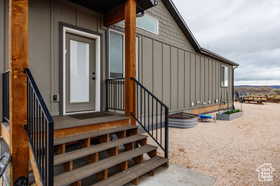 Doorway to property with board and batten siding
