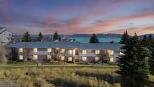 Rear view of property featuring stairs and a mountain view