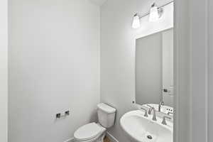 Bathroom featuring a sink and toilet