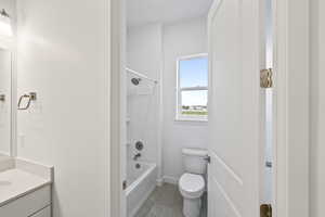 Bathroom with shower / bathtub combination and vanity