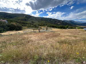 View of mountain background featuring rural landscape